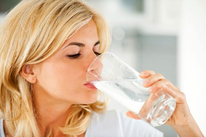 Lazy man drinking water on a diet photo 1