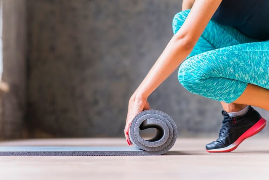 Girl rolling carpet